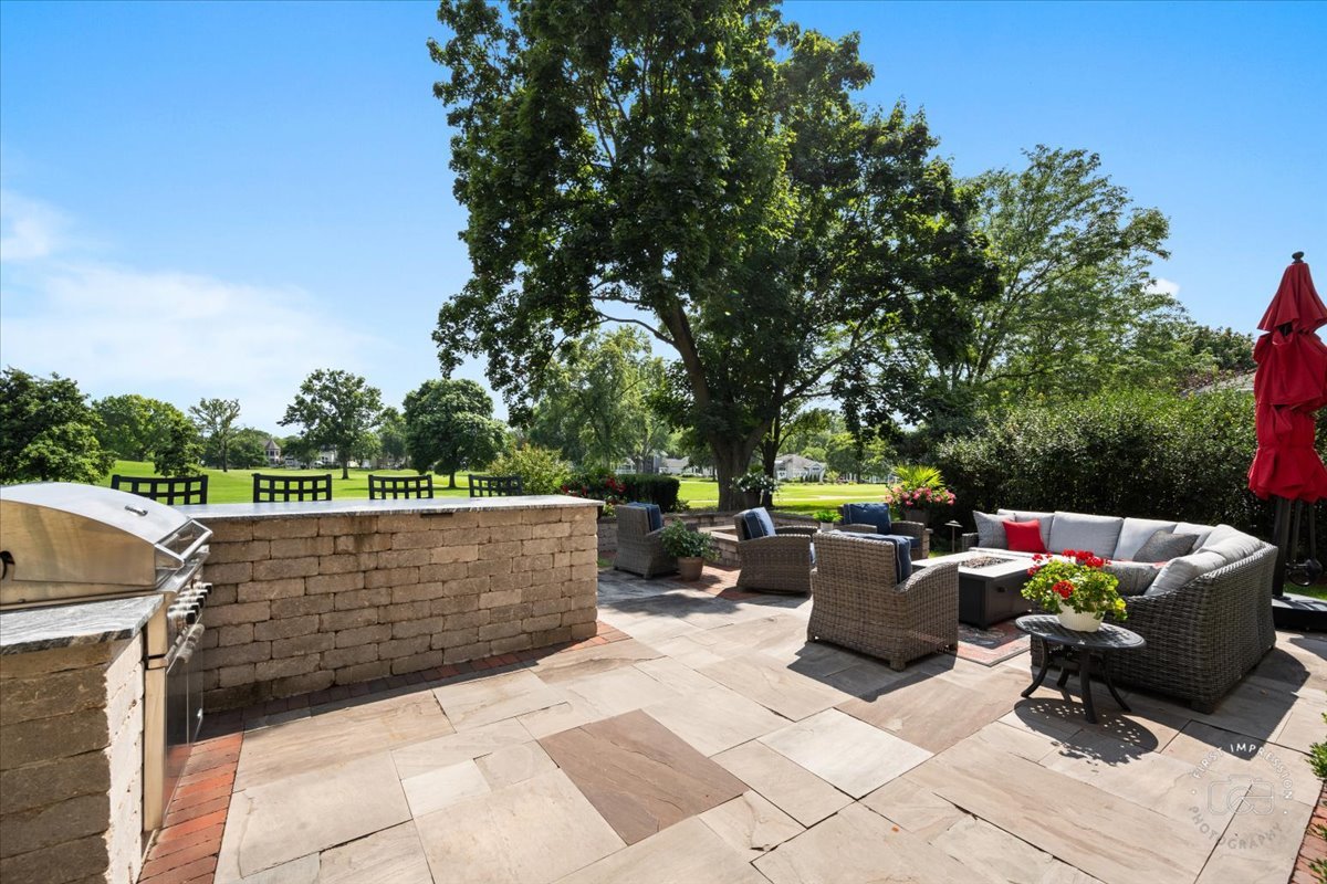 958 West Bauer Road Naperville, IL 60563 - Photo 49 of 57 a view of patio with couches and a fire pit