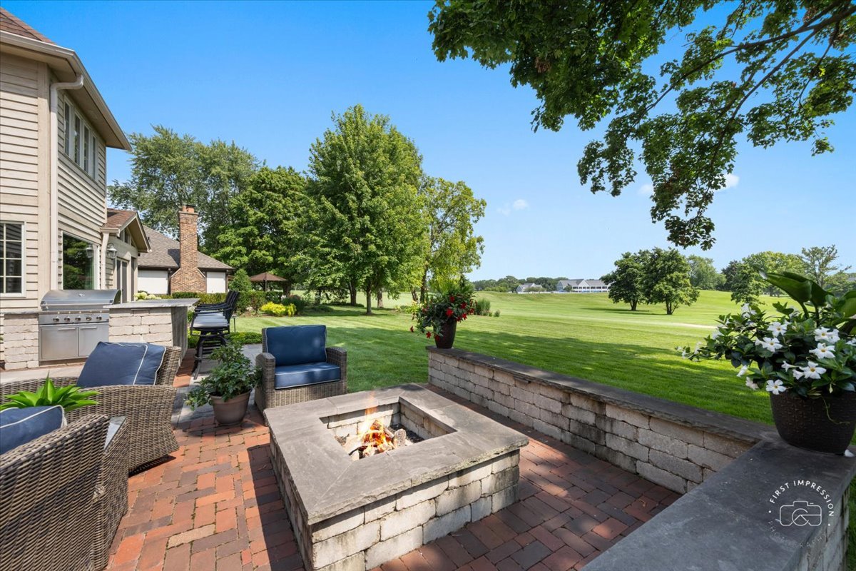958 West Bauer Road Naperville, IL 60563 - Photo 51 of 57 a view of a backyard with sitting area