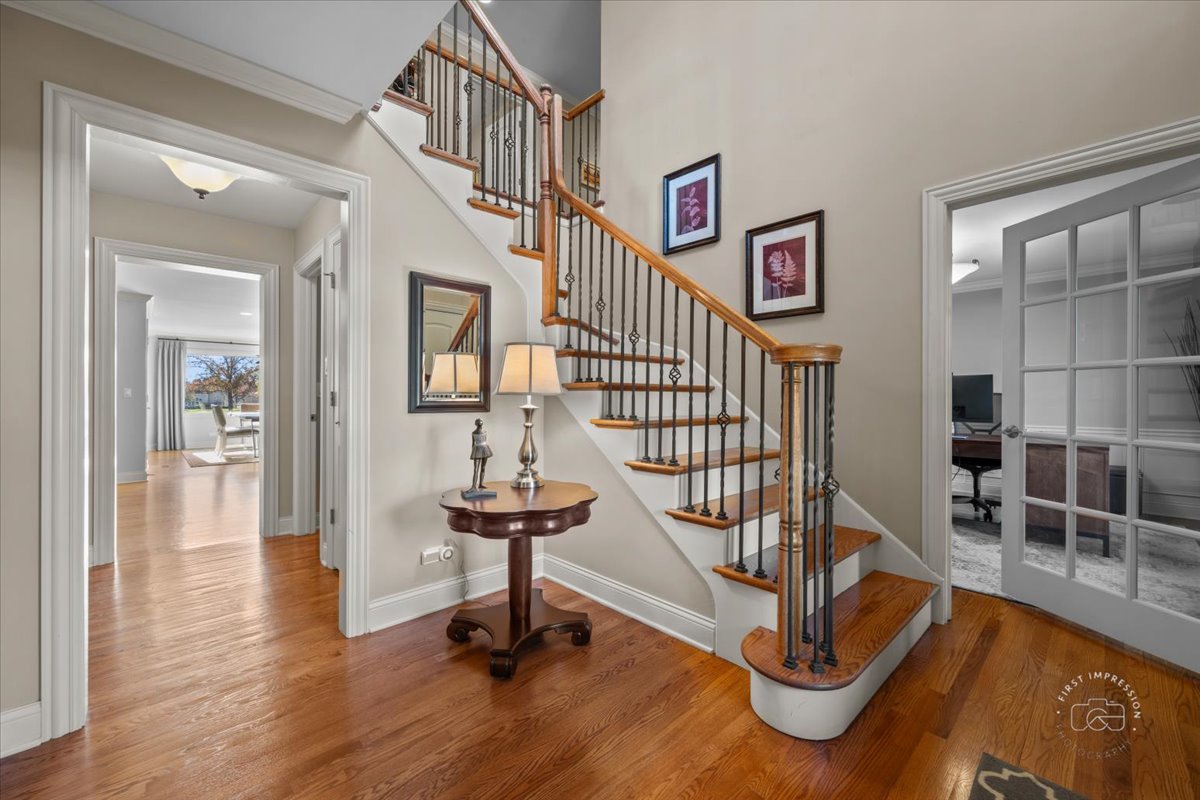 958 West Bauer Road Naperville, IL 60563 - Photo 7 of 57 a view of entryway with wooden floor and livingroom view