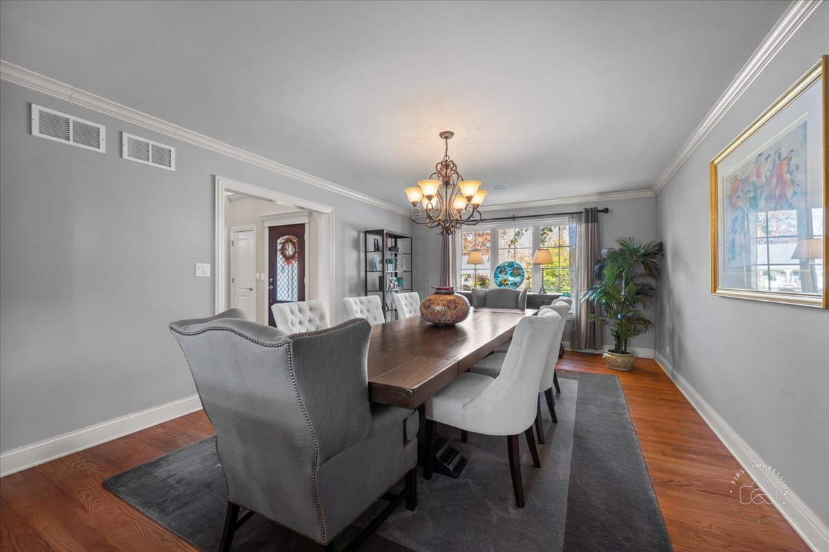958 West Bauer Road Naperville, IL 60563 - Photo 9 of 57 a view of a dining room with furniture and a chandelier