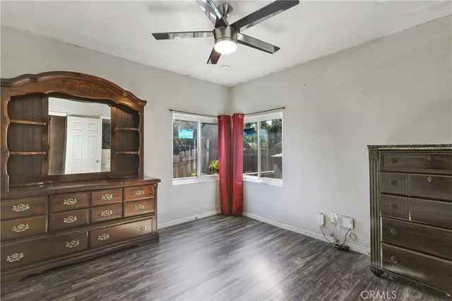 a view of room with cabinet and windows