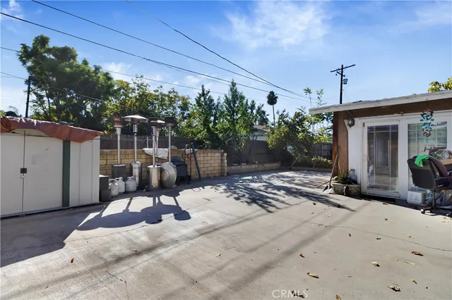 a view of a backyard with sitting area