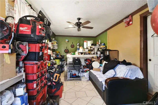 a bed room with a bed and a chandelier