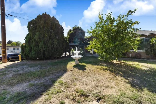 a backyard of a house with lots of green space