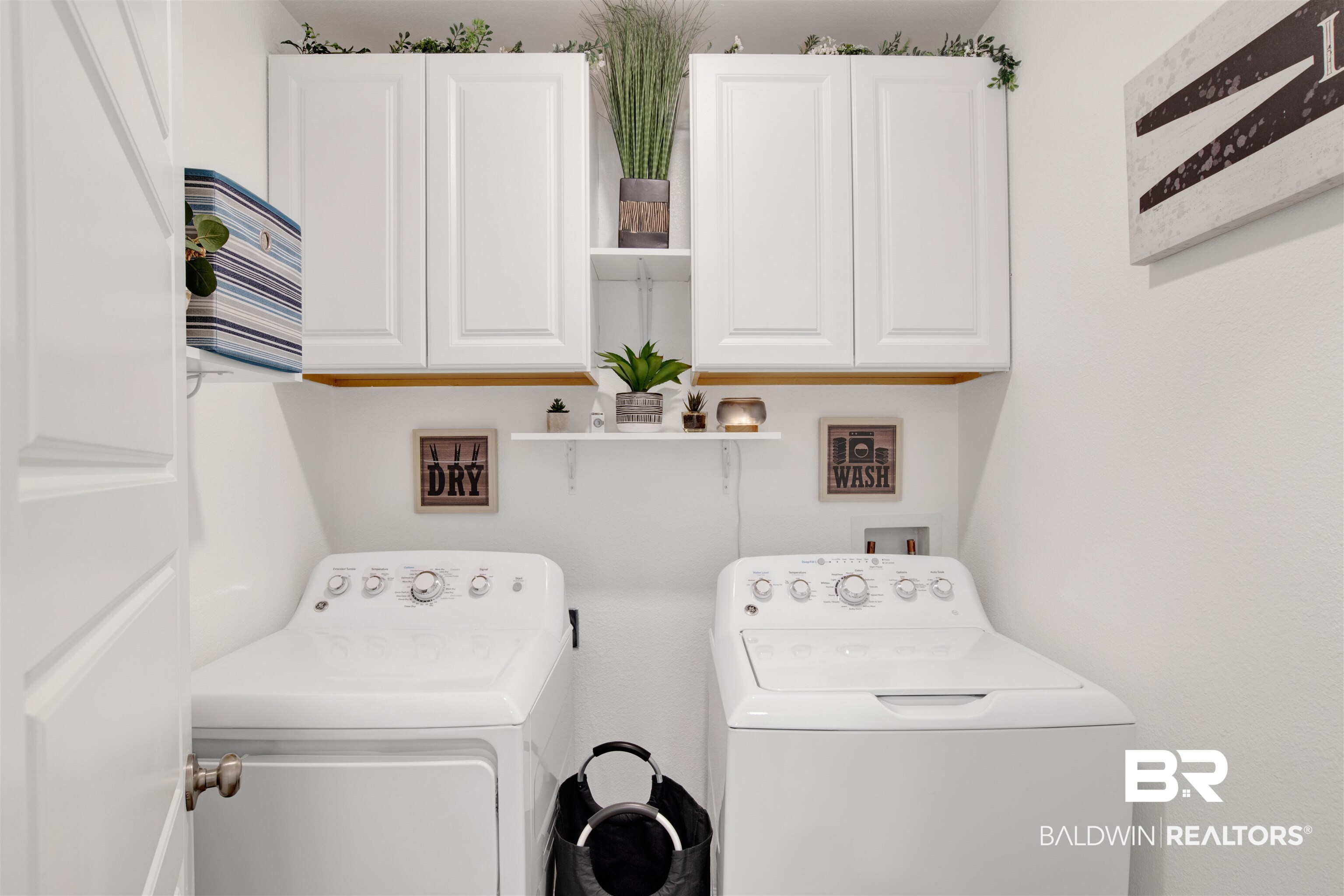 8102 Irwin Loop Daphne, AL 36526 - Photo 23 of 30 Laundry room with separate washer and dryer and cabinets
