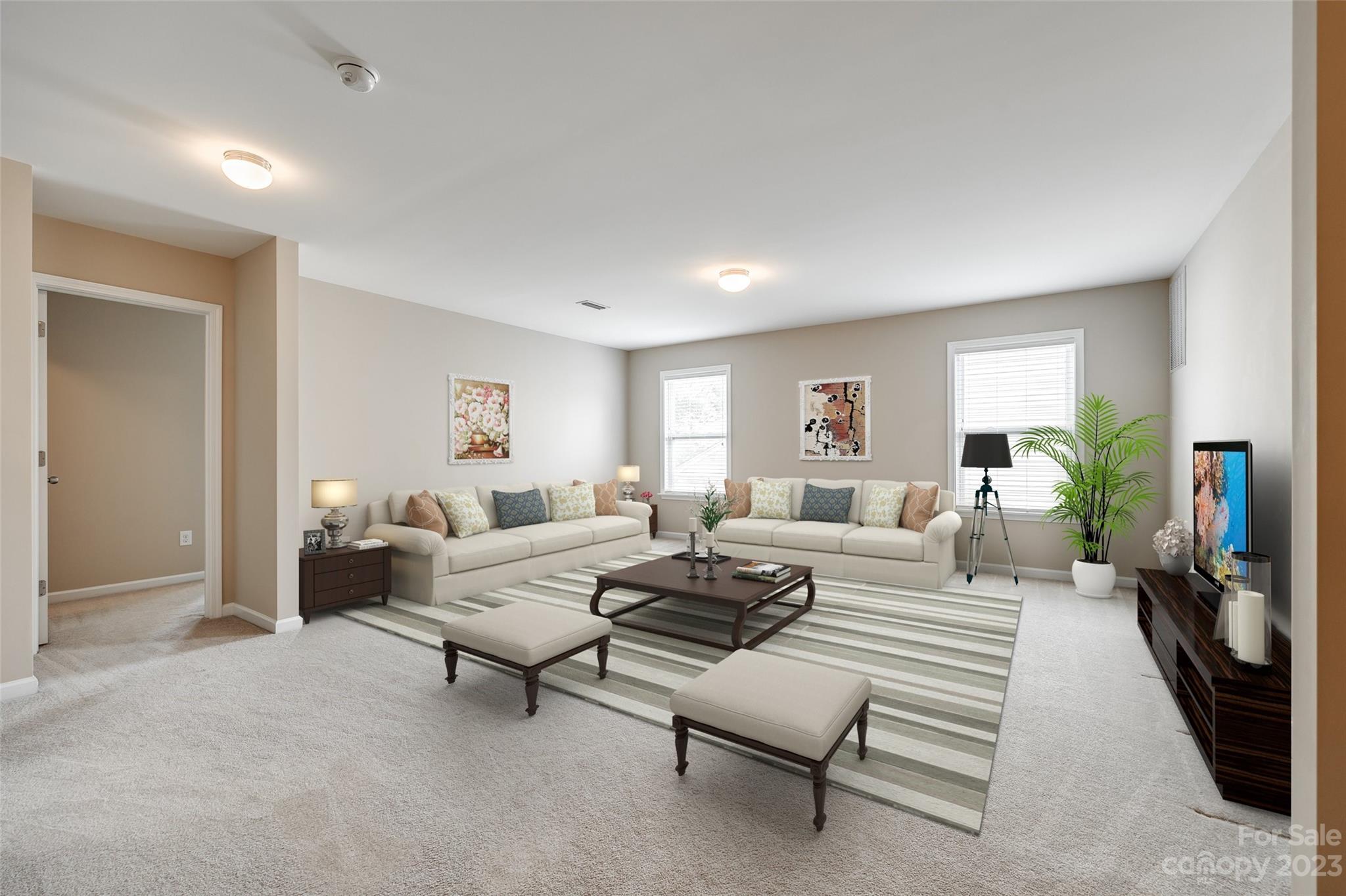 8055 Bryson Road Indian Land, SC 29707 - Photo 15 of 45 a living room with furniture and a wooden floor