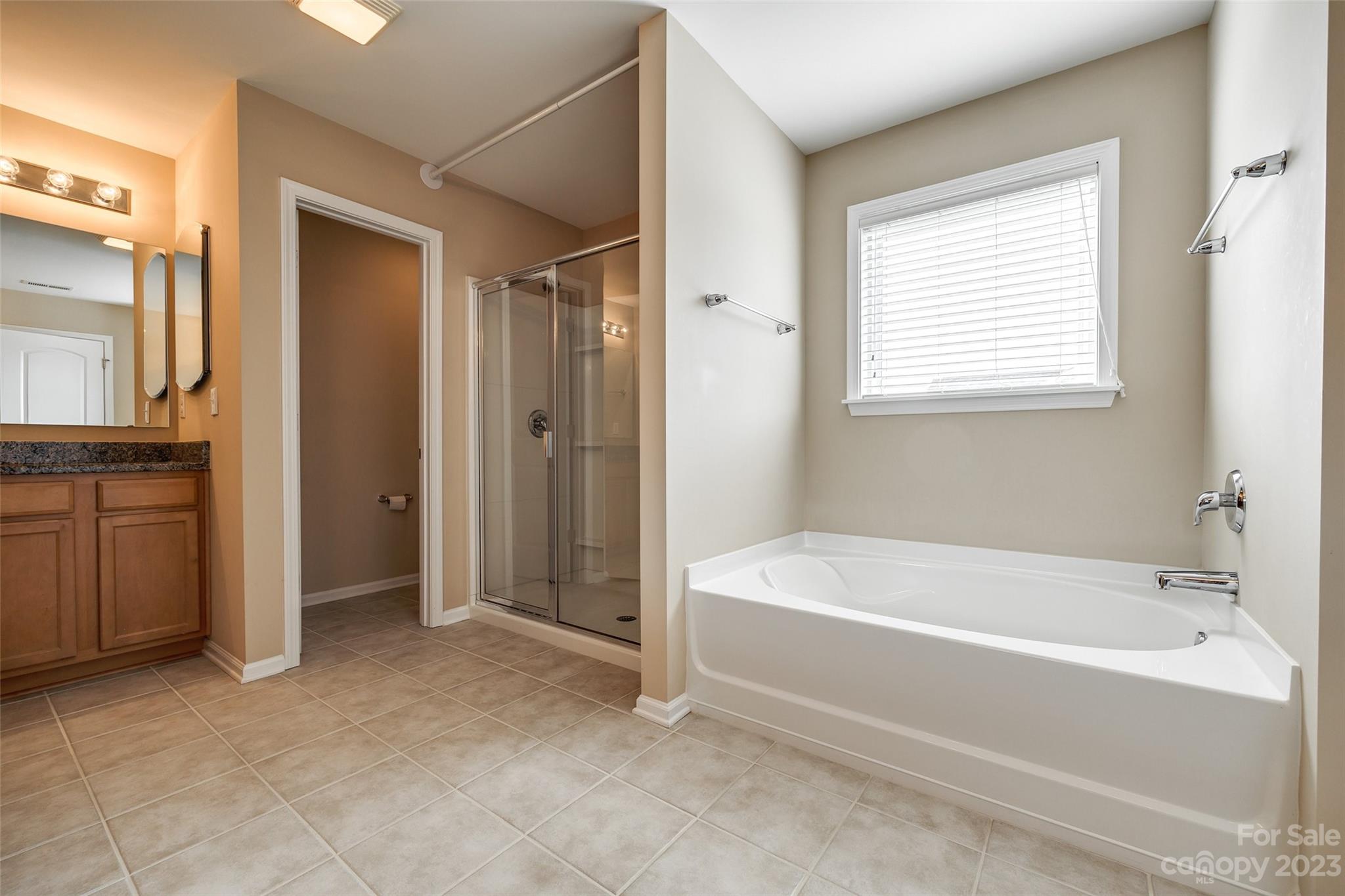 8055 Bryson Road Indian Land, SC 29707 - Photo 18 of 45 a bathroom with a bathtub and a shower