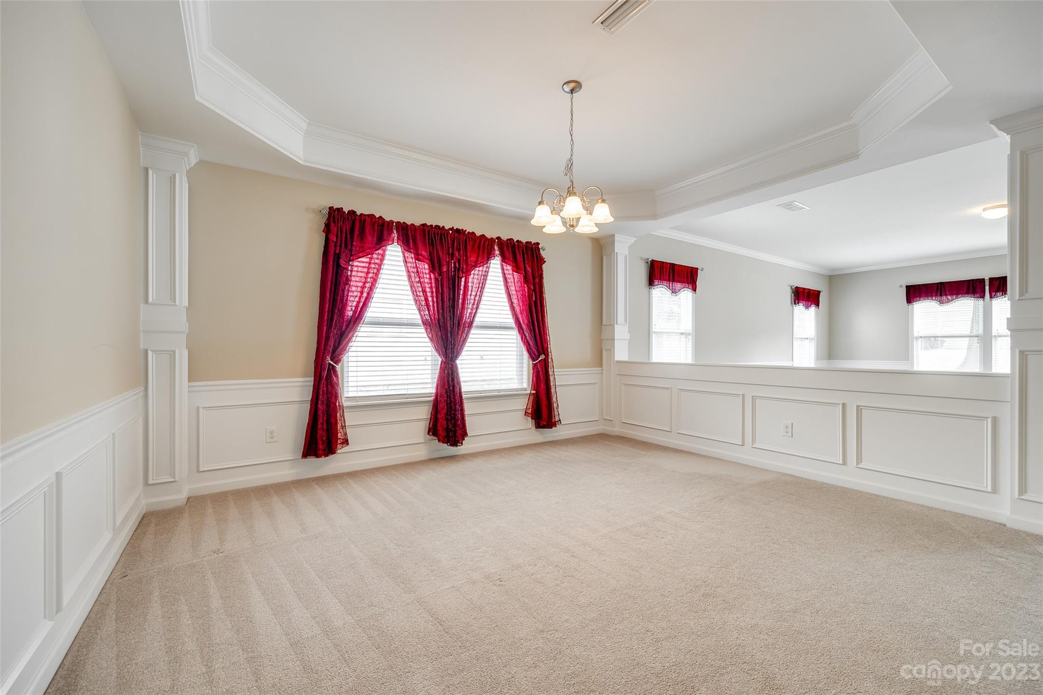 8055 Bryson Road Indian Land, SC 29707 - Photo 25 of 45 a view of an empty room with window and chandelier fan