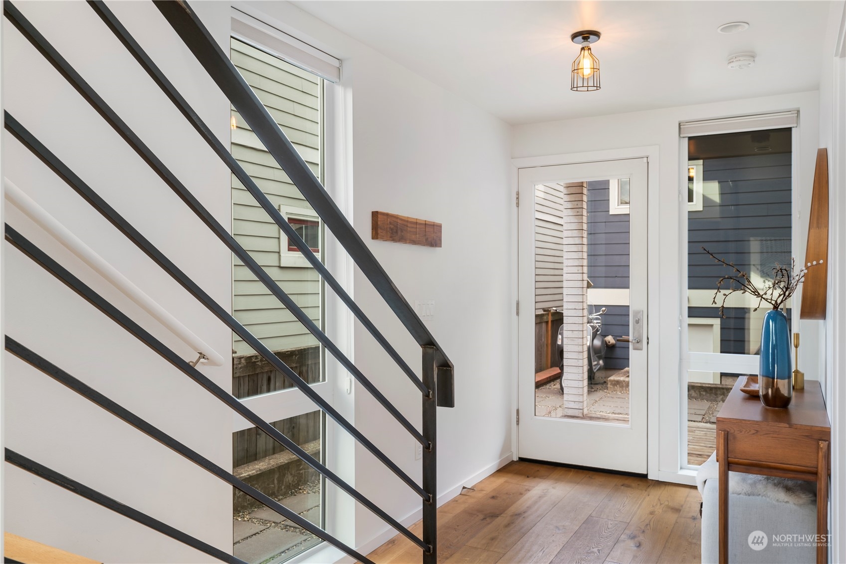 1122 23rd Avenue South, Unit C Seattle, WA 98144 - Photo 21 of 27 a view of entryway with wooden floor and stairs