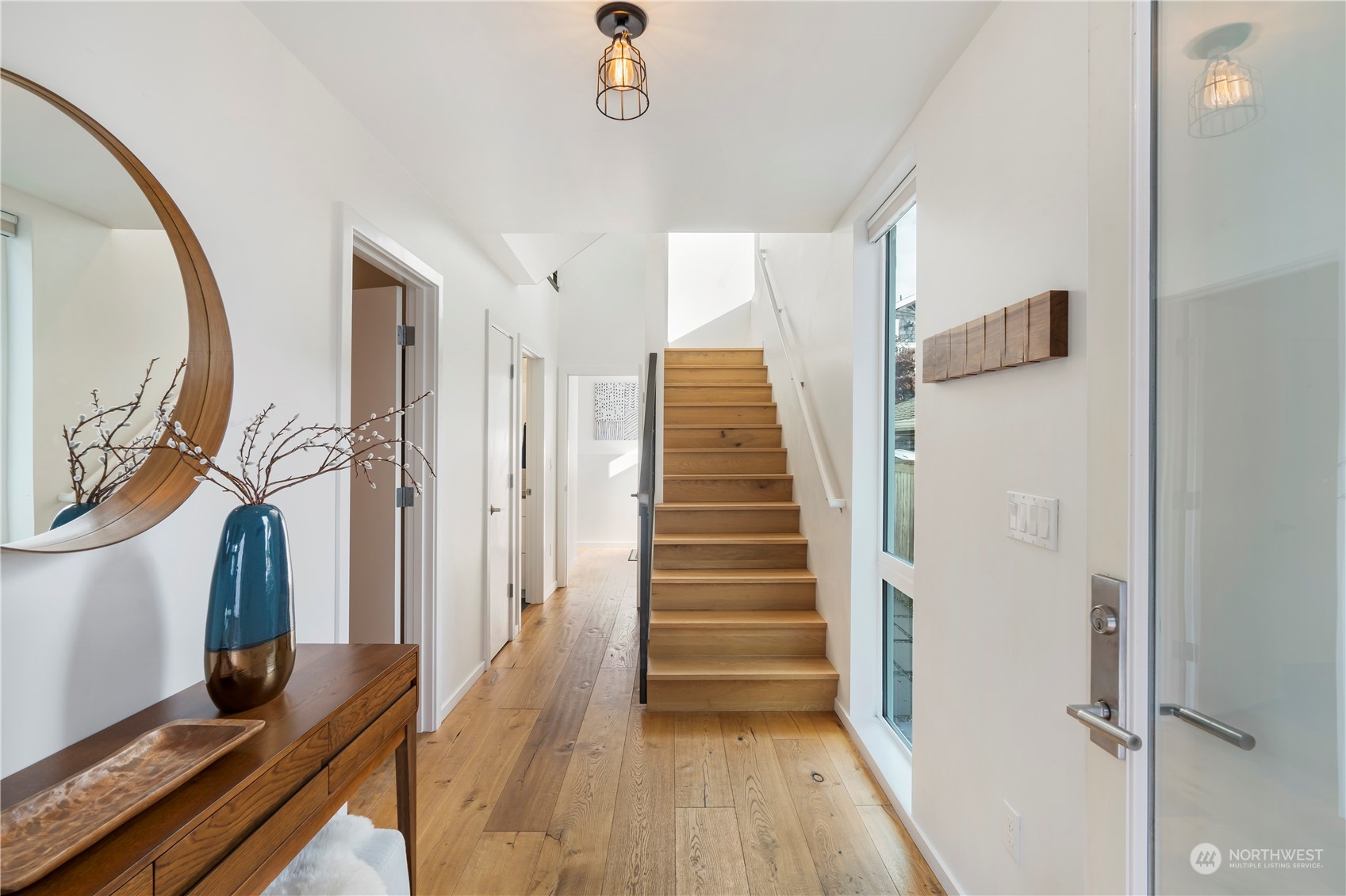 1122 23rd Avenue South, Unit C Seattle, WA 98144 - Photo 22 of 27 a view of a livingroom with wooden floor and stairs