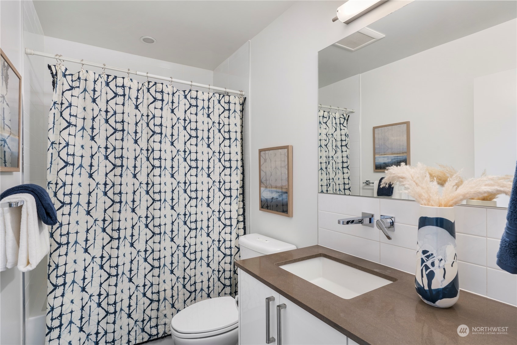 1122 23rd Avenue South, Unit C Seattle, WA 98144 - Photo 24 of 27 a bathroom with a sink toilet and shower
