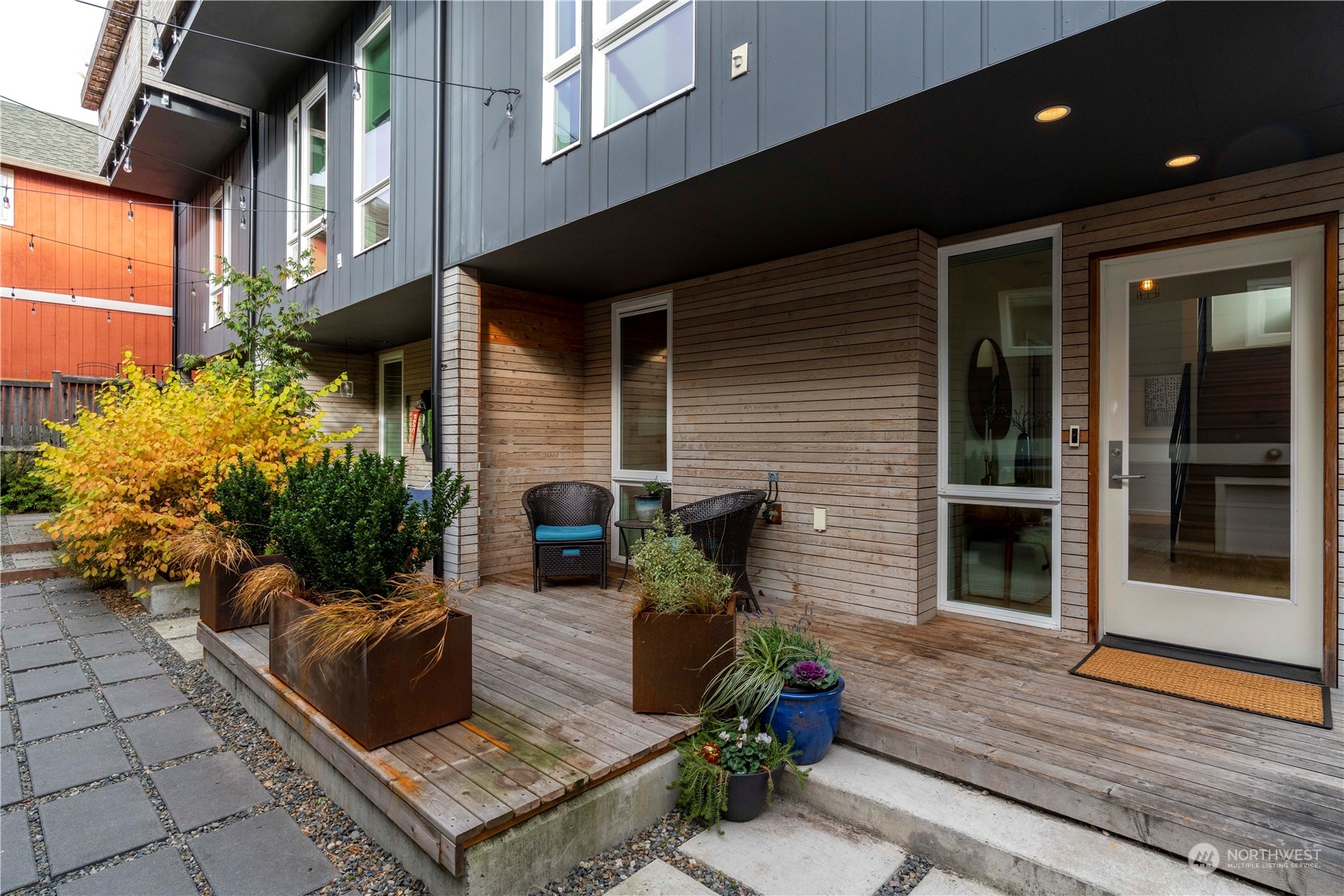 1122 23rd Avenue South, Unit C Seattle, WA 98144 - Photo 27 of 27 a view of a patio with a chairs and table in a patio