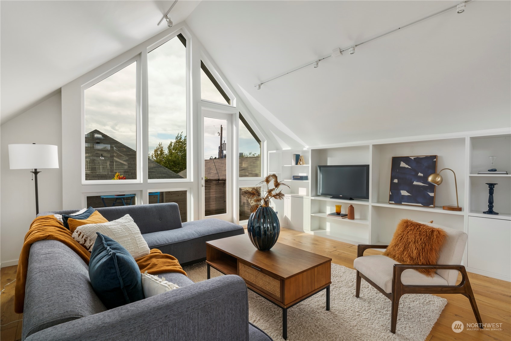 1122 23rd Avenue South, Unit C Seattle, WA 98144 - Photo 4 of 27 a living room with furniture and a large window