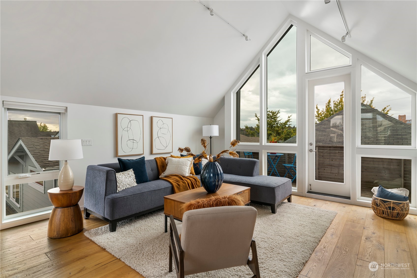 1122 23rd Avenue South, Unit C Seattle, WA 98144 - Photo 5 of 27 a living room with furniture and a floor to ceiling window