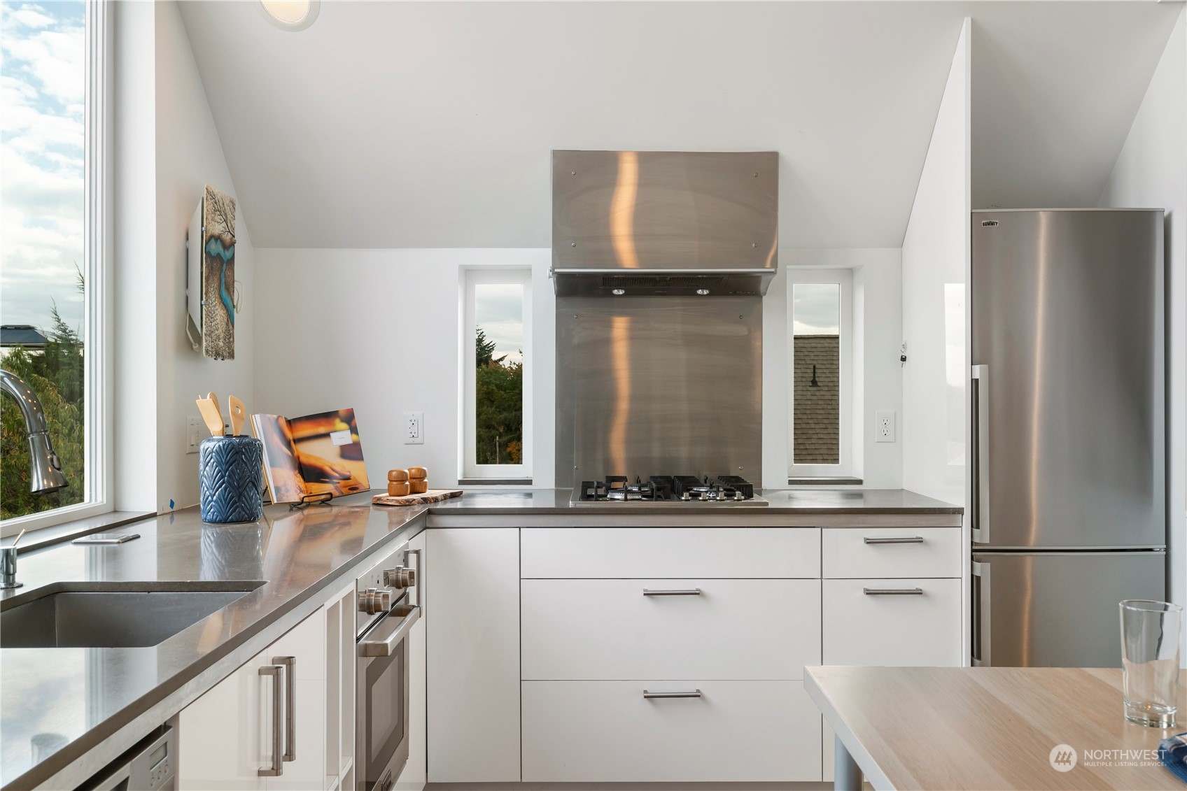 1122 23rd Avenue South, Unit C Seattle, WA 98144 - Photo 10 of 27 a kitchen with white cabinets and sink