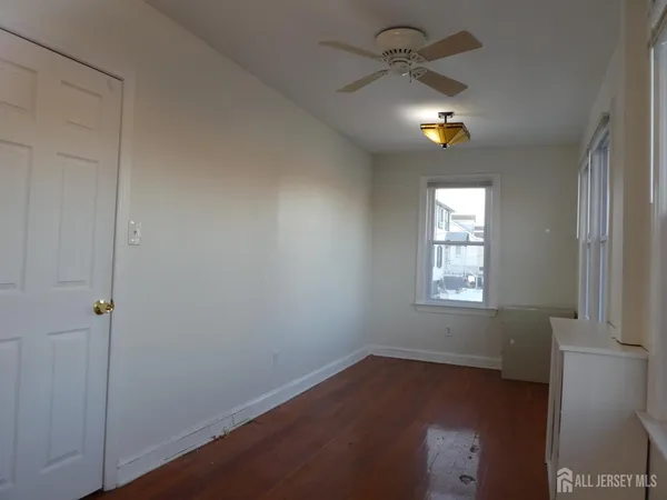 an empty room with windows and natural light