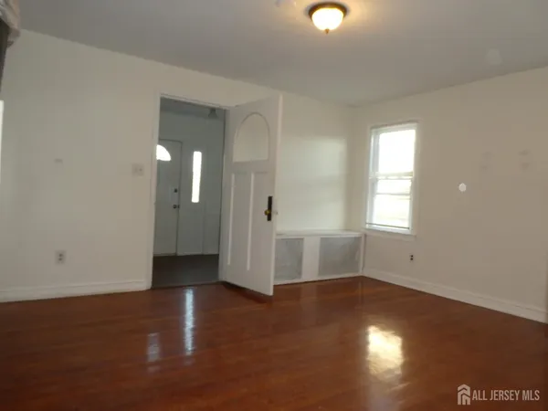 a view of a livingroom with wooden floor