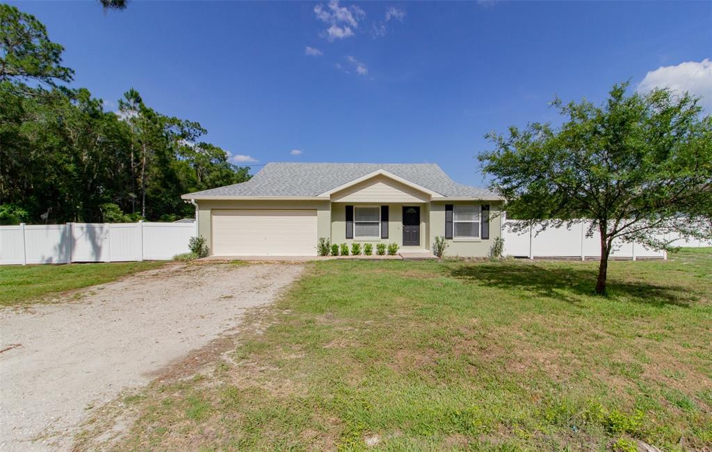 4353 Rushing Road Lakeland, FL 33810 - Photo 1 of 1 a front view of a house with a garden