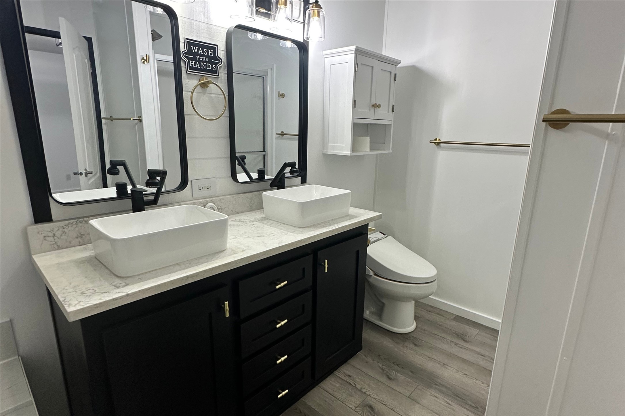 1601 East Slaughter Lane, Unit 464 Austin, TX 78747 - Photo 13 of 26 Full bathroom featuring double vanity and light wood-style floors