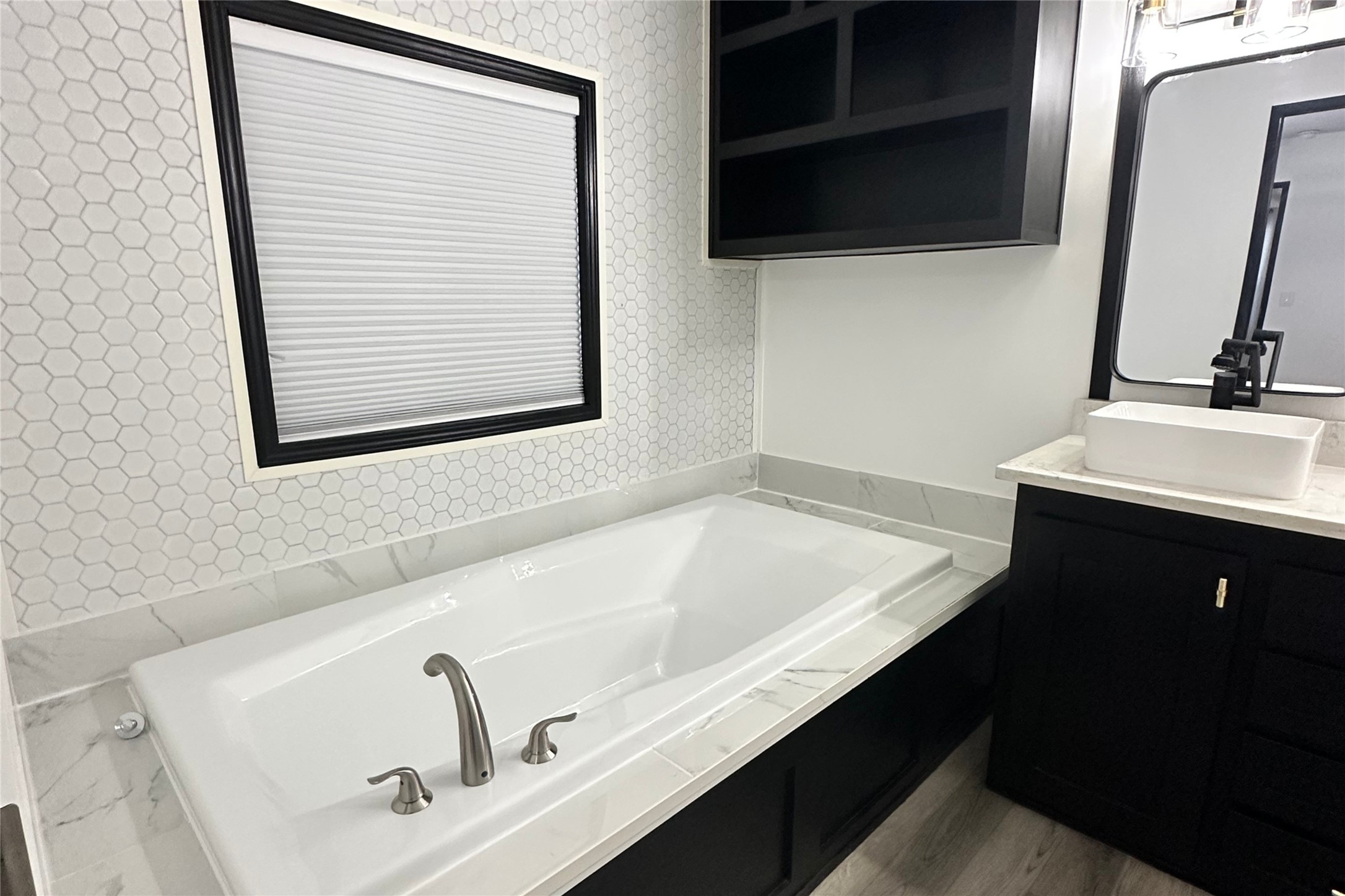 1601 East Slaughter Lane, Unit 464 Austin, TX 78747 - Photo 14 of 26 Bathroom with wallpapered walls, a garden tub, and vanity