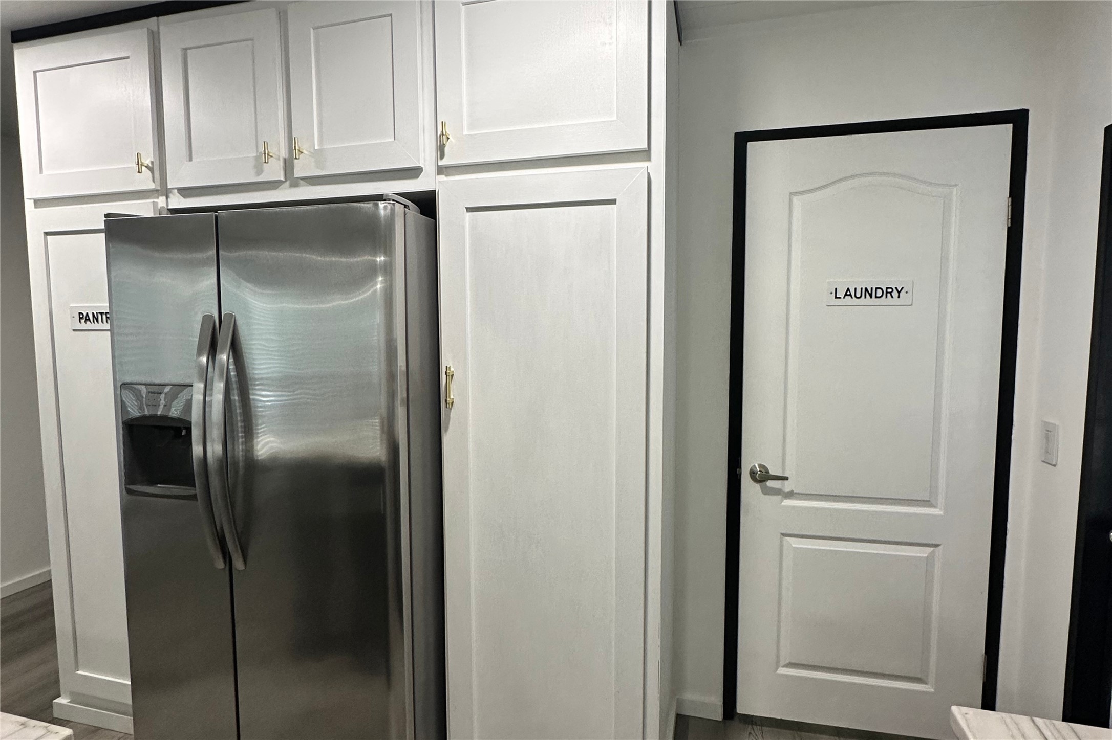 1601 East Slaughter Lane, Unit 464 Austin, TX 78747 - Photo 19 of 26 Kitchen with stainless steel refrigerator with ice dispenser and dark wood finished floors
