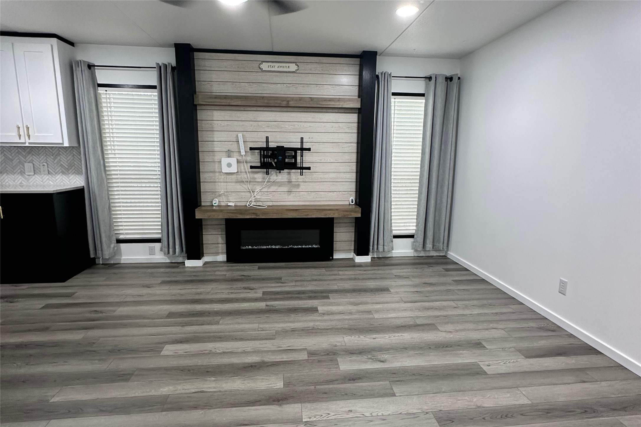 1601 East Slaughter Lane, Unit 464 Austin, TX 78747 - Photo 3 of 26 Unfurnished living room with light wood-style flooring and healthy amount of natural light