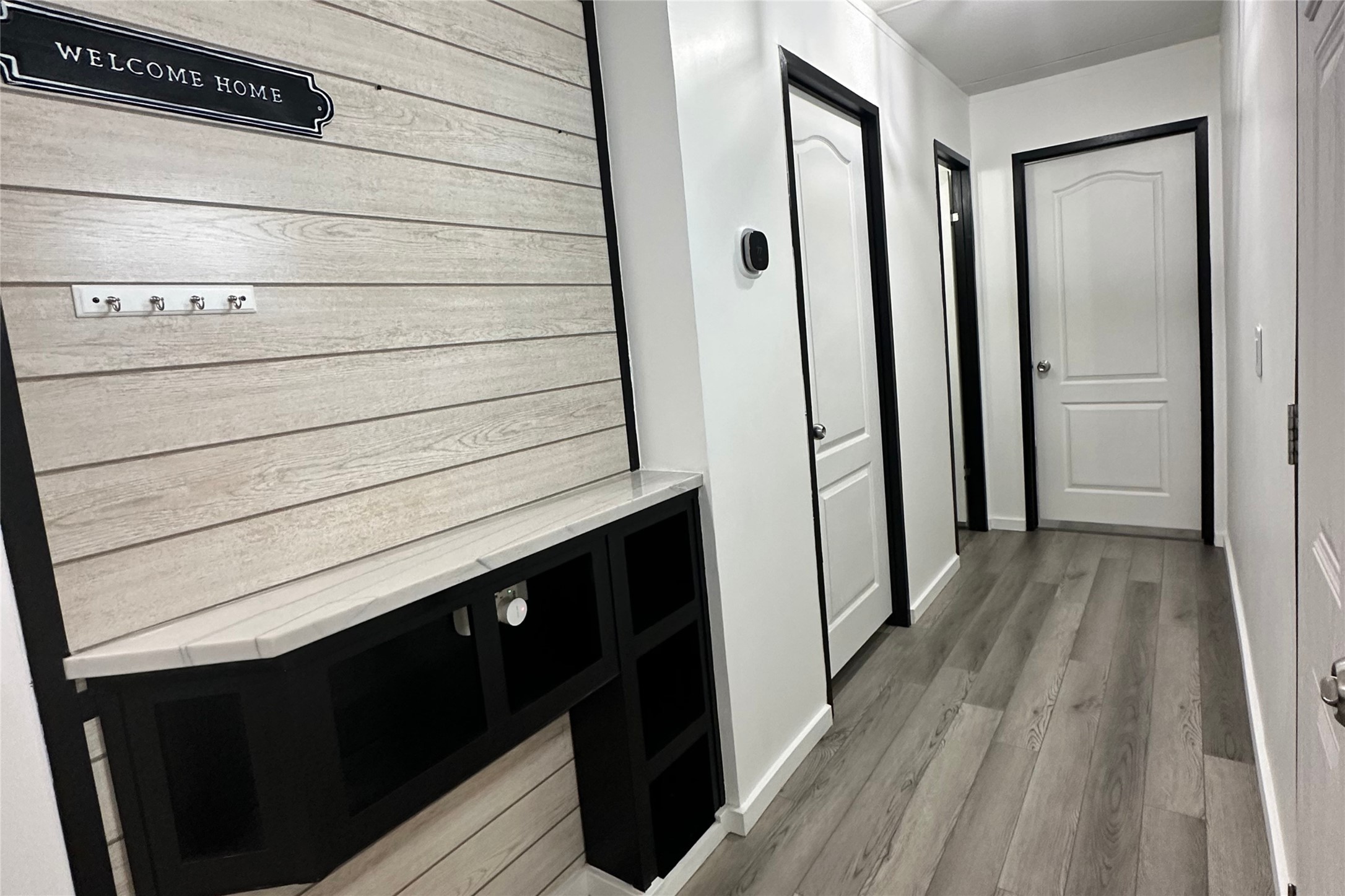 1601 East Slaughter Lane, Unit 464 Austin, TX 78747 - Photo 5 of 26 Hall with light wood-type flooring and baseboards