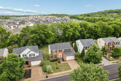 an aerial view of a house with a garden