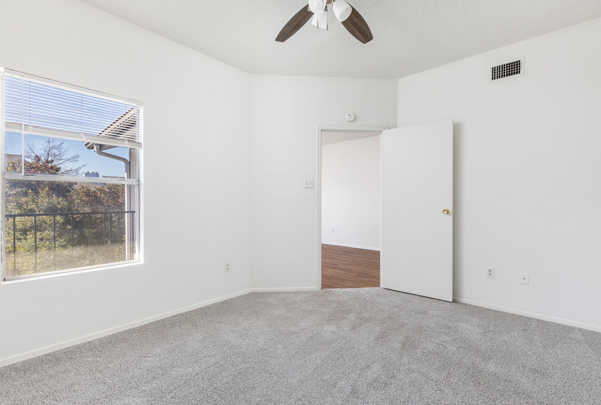 12166 Metric Boulevard, Unit 230 Austin, TX 78758 - Photo 19 of 32 an empty room with windows and view of closet