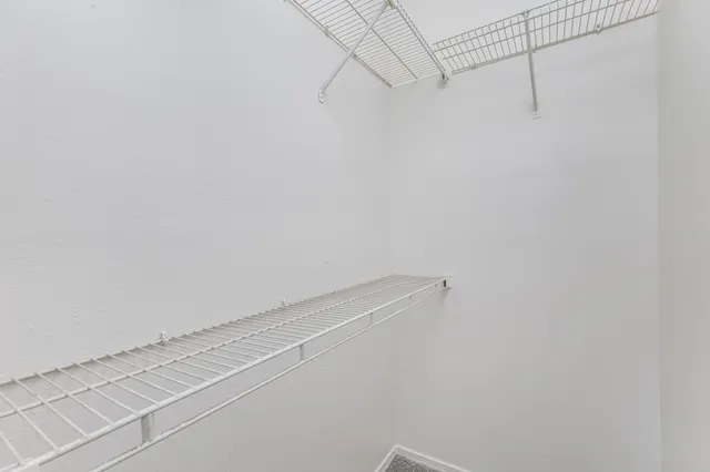 a view of a room with racks on the wall