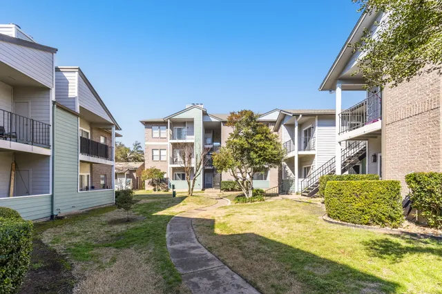 a view of a building with a yard