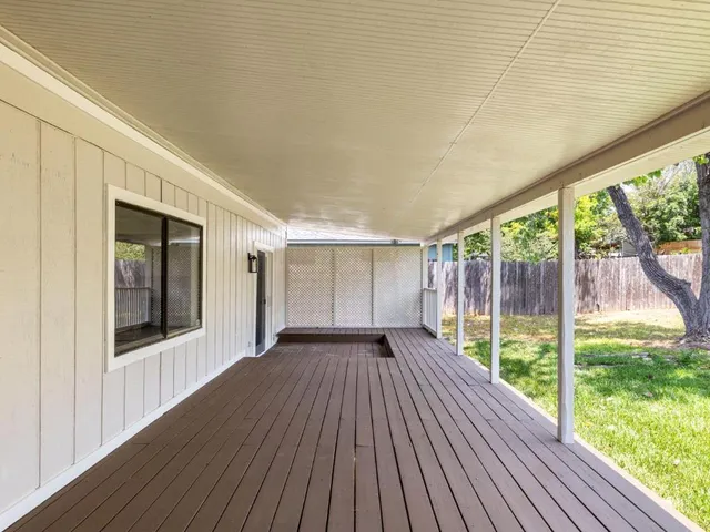 a view of outdoor space with wooden floor and backyard