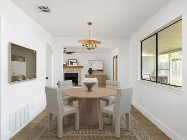 a dining room with furniture and window