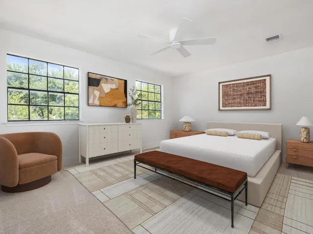 a bedroom with a bed and a couch