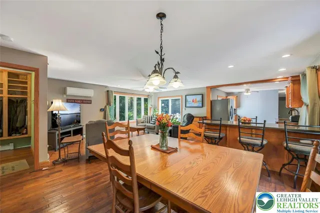a bathroom with a granite countertop toilet sink and mirror