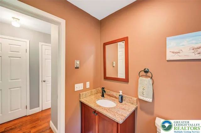 a view of hallway with wooden floor