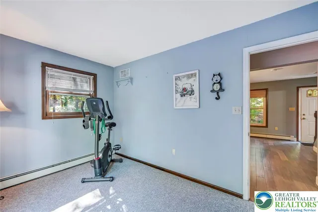 a view of a deck with furniture and garden