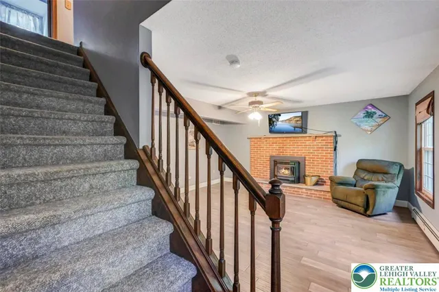 a front view of a house with large windows