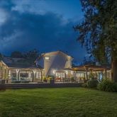 an aerial view of a house with a swimming pool