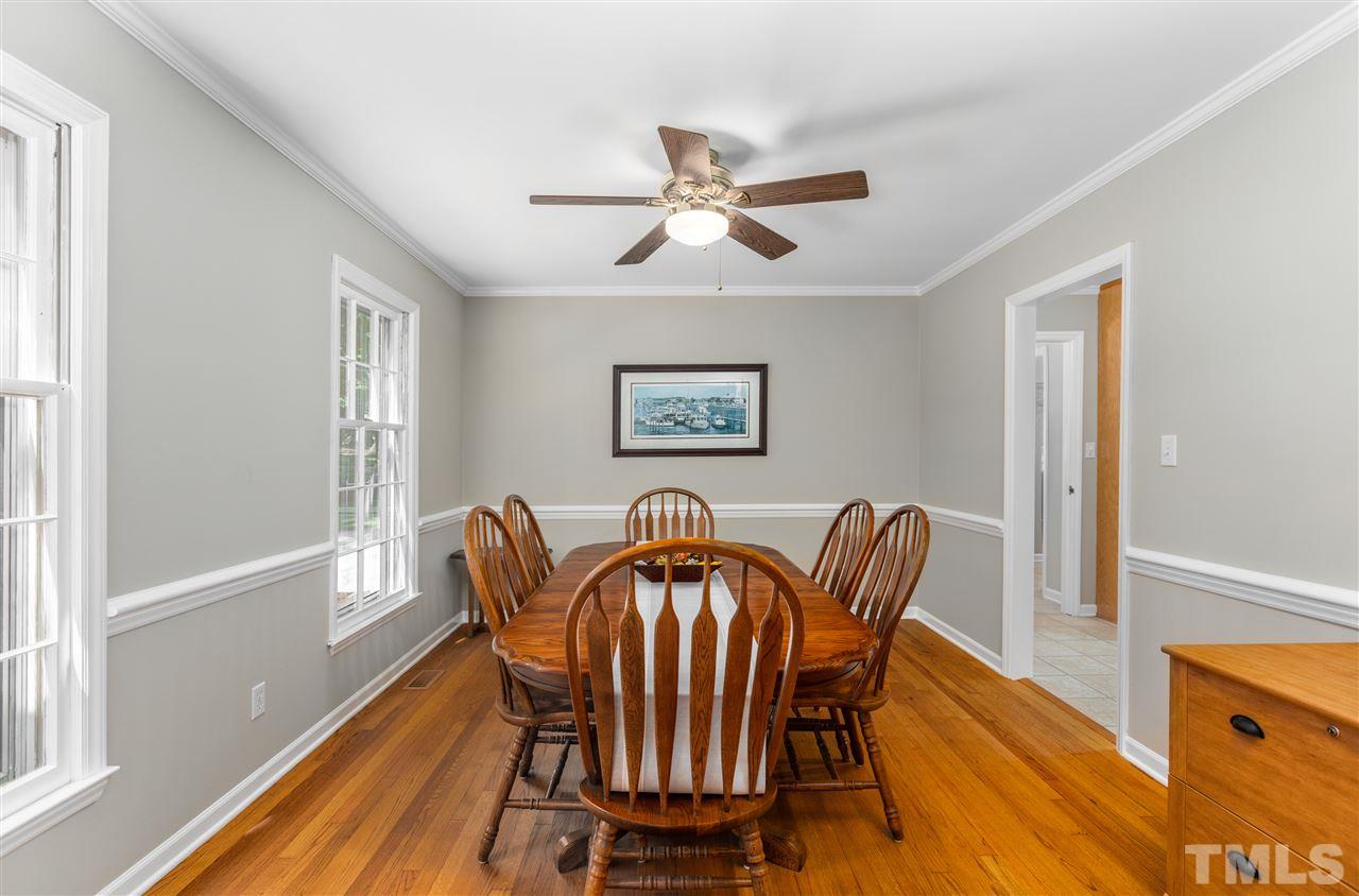 11508 Hardwick Court Raleigh, NC 27614 - Photo 12 of 30 a view of a dining room with furniture window and wooden floor