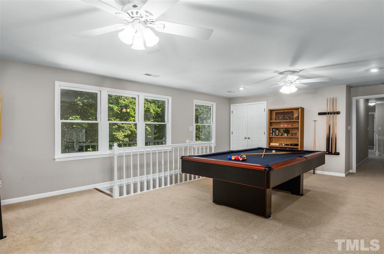 11508 Hardwick Court Raleigh, NC 27614 - Photo 17 of 30 a living room with pool table and a window