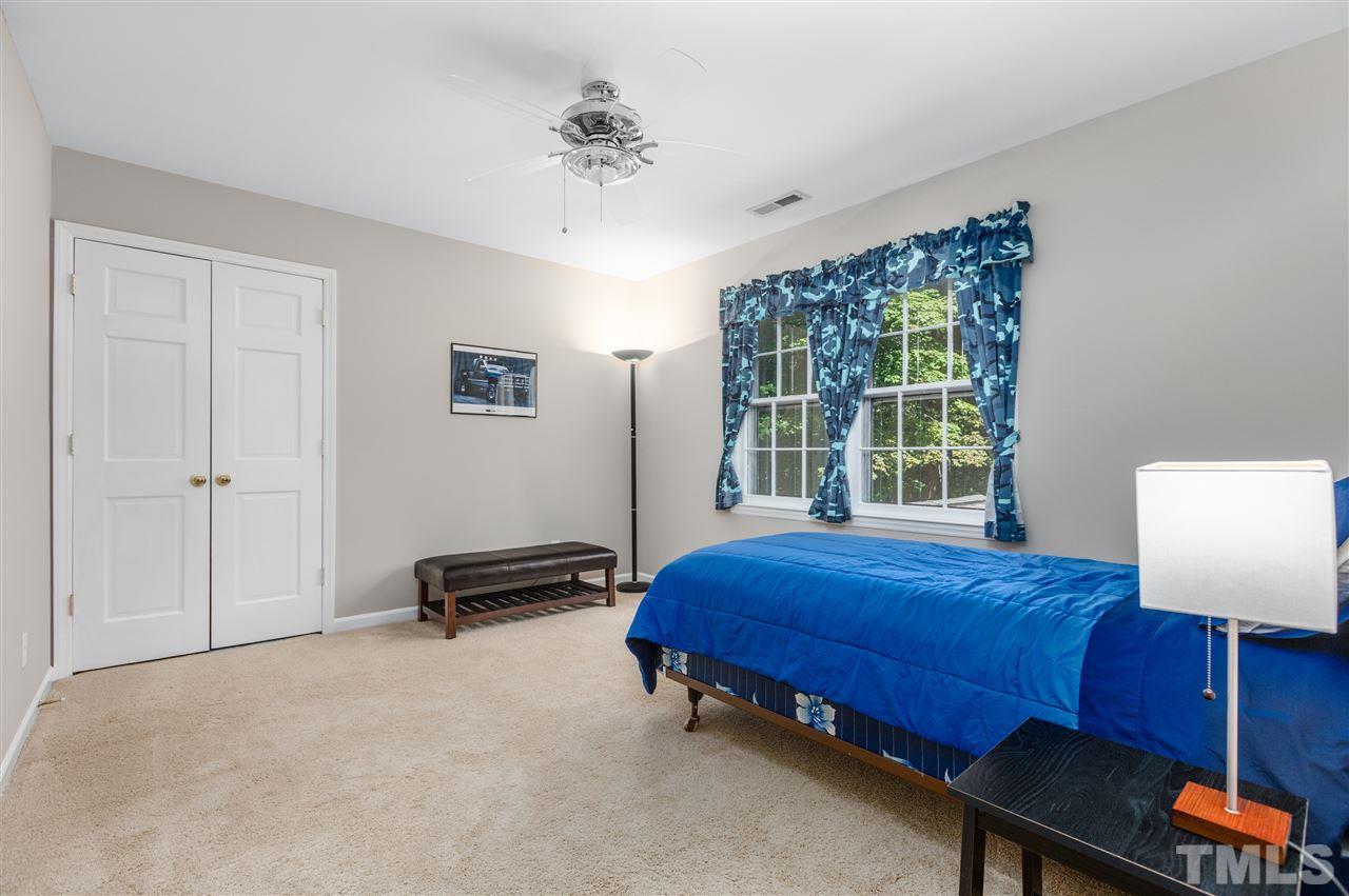 11508 Hardwick Court Raleigh, NC 27614 - Photo 19 of 30 a bedroom with a bed and a window