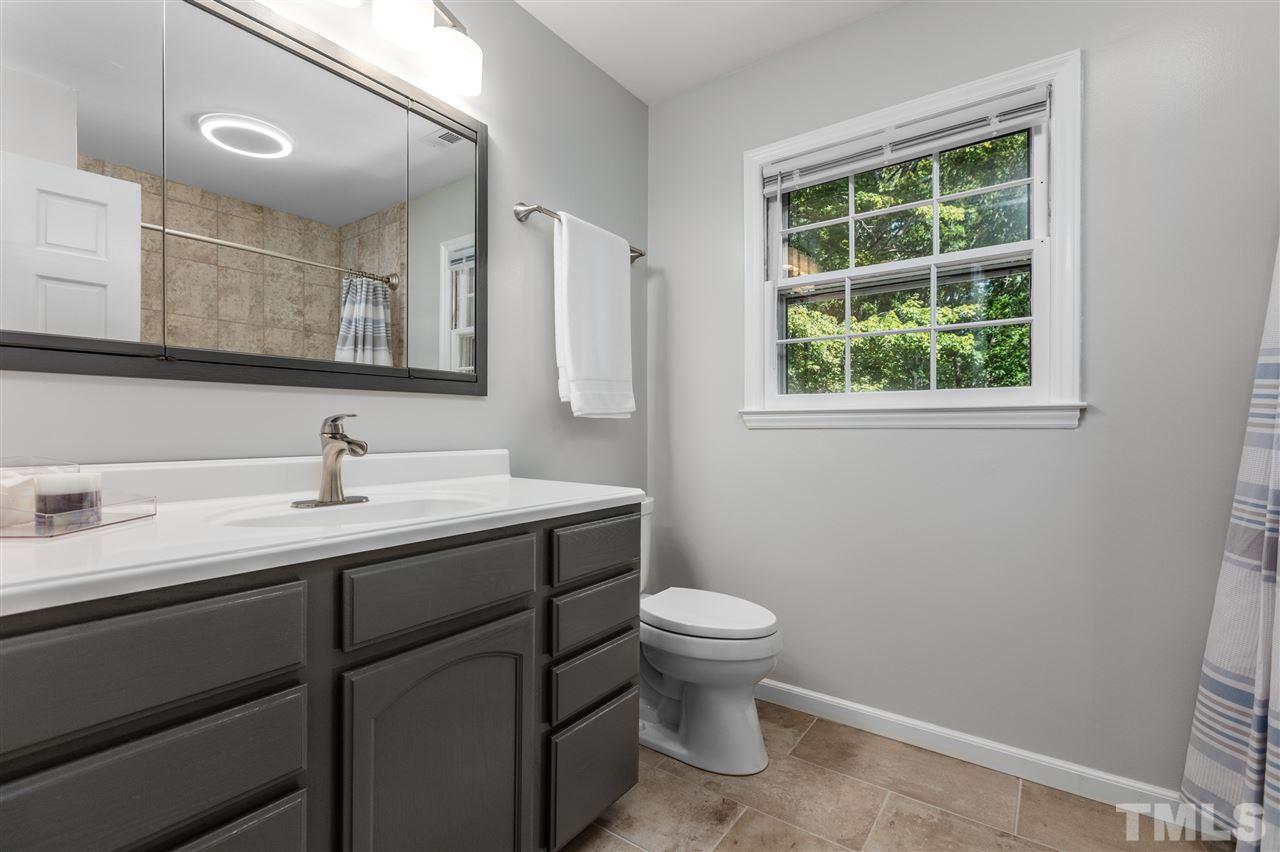11508 Hardwick Court Raleigh, NC 27614 - Photo 20 of 30 a bathroom with a sink toilet and a mirror