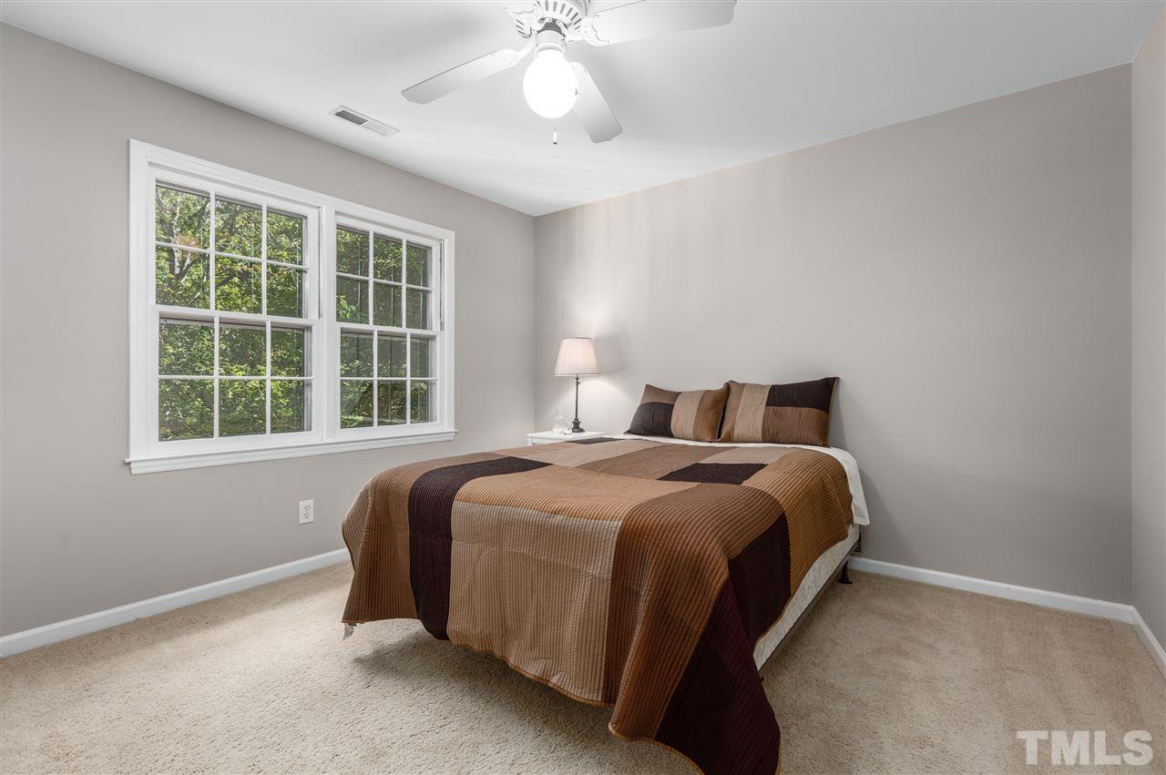 11508 Hardwick Court Raleigh, NC 27614 - Photo 21 of 30 a bedroom with a bed and window