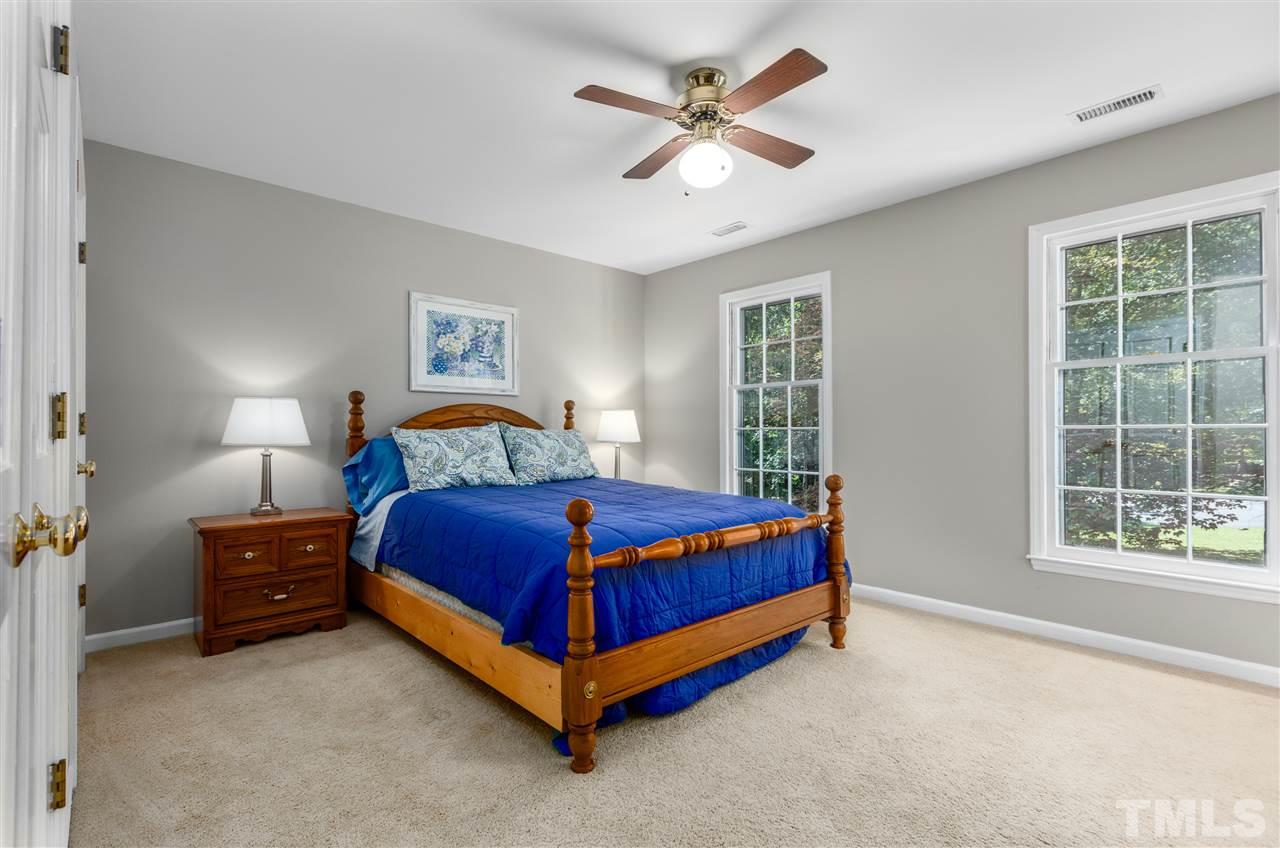 11508 Hardwick Court Raleigh, NC 27614 - Photo 22 of 30 a bedroom with a bed and a window