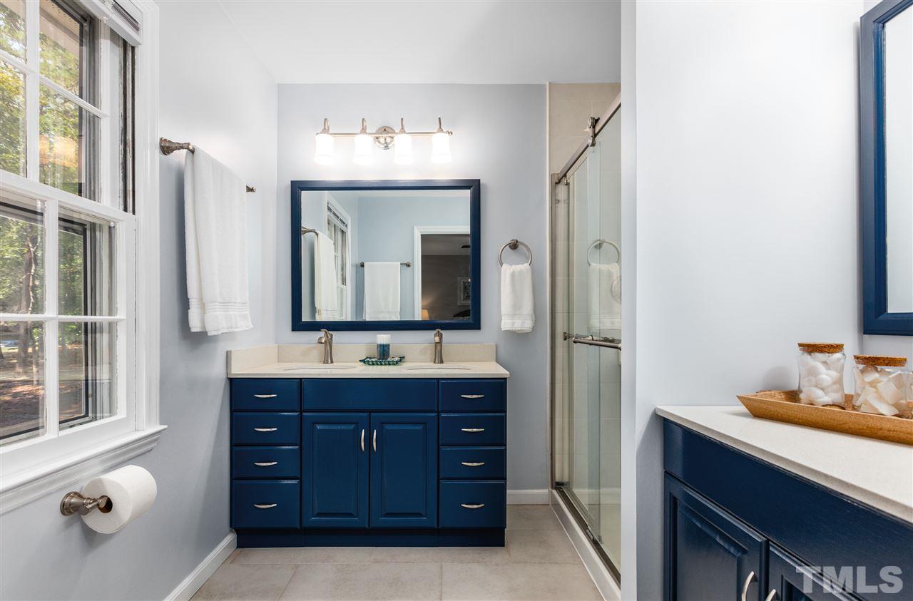 11508 Hardwick Court Raleigh, NC 27614 - Photo 24 of 30 a bathroom with a double vanity sink double and mirror
