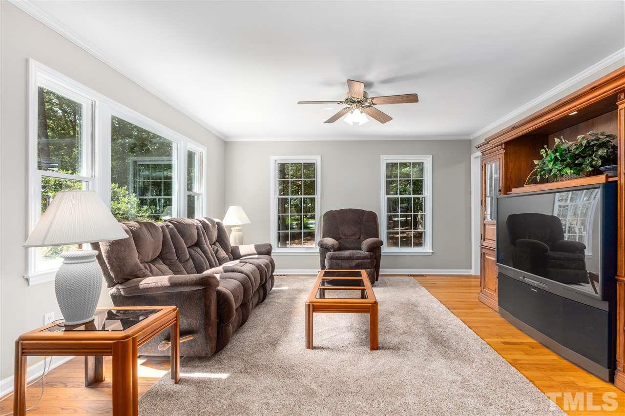 11508 Hardwick Court Raleigh, NC 27614 - Photo 5 of 30 a living room with furniture a window and a fireplace