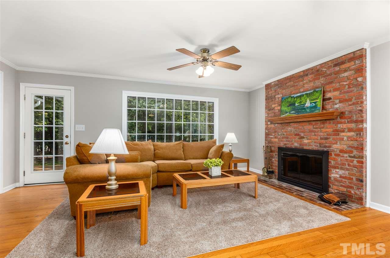 11508 Hardwick Court Raleigh, NC 27614 - Photo 6 of 30 a living room with furniture and a fireplace