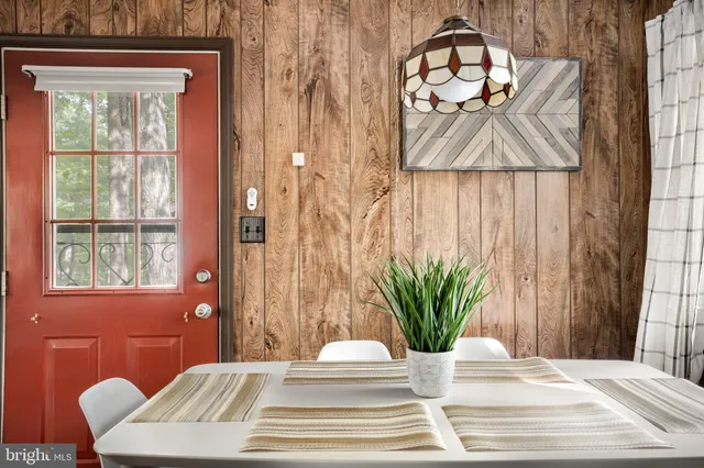 a bathroom with a potted plant and a window
