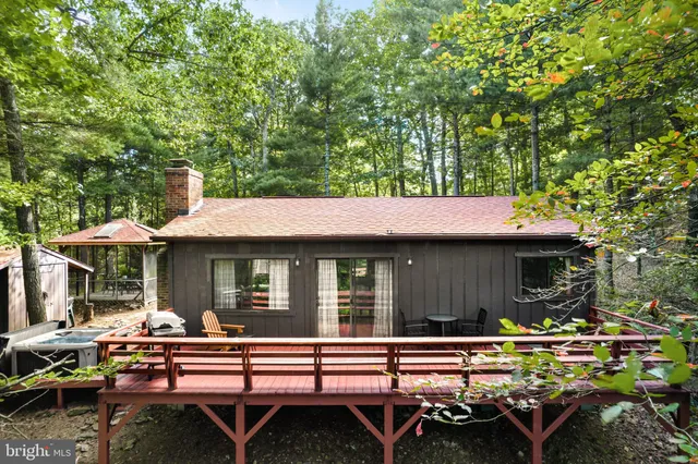 a view of house with outdoor seating